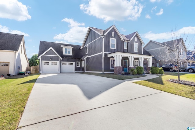 view of front of house with driveway, board and batten siding, and a front lawn