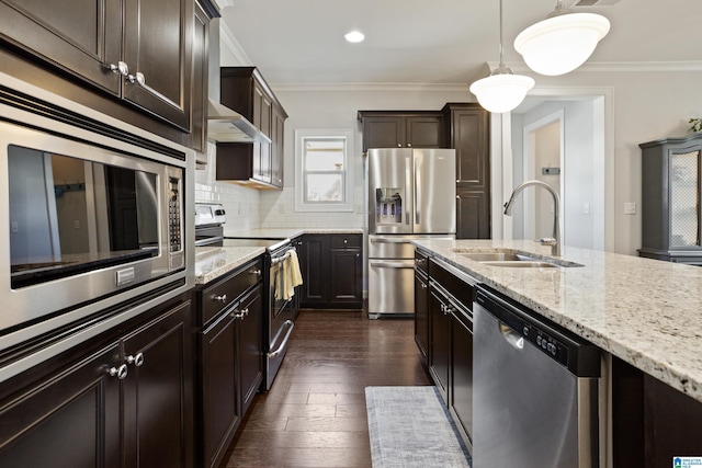 kitchen with a sink, dark wood-style floors, light stone counters, and stainless steel appliances
