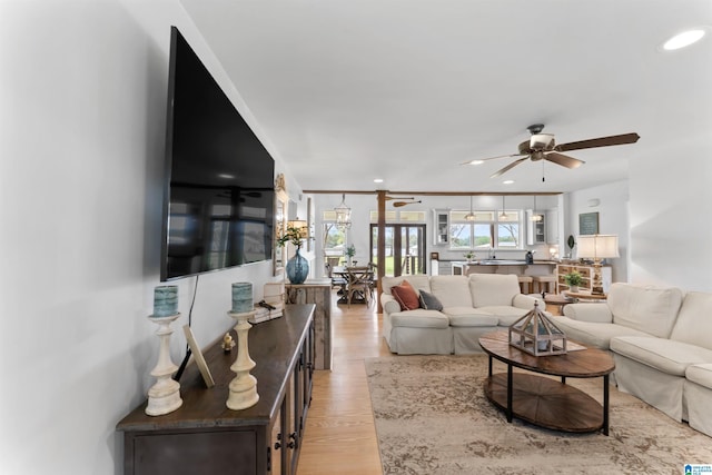 living area featuring light wood-type flooring, recessed lighting, and a ceiling fan