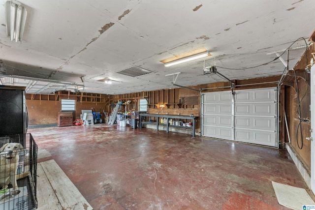 garage featuring a garage door opener