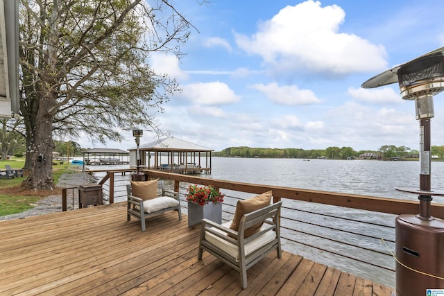 dock area with a water view and a gazebo