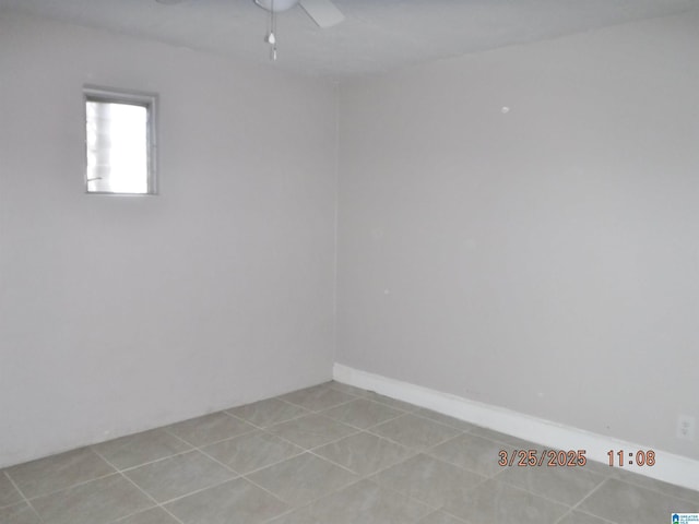 unfurnished room featuring ceiling fan and light tile patterned floors