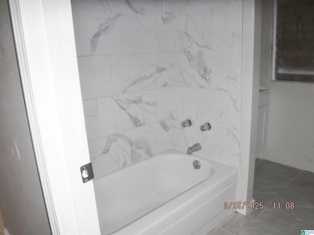 full bath featuring a tub to relax in