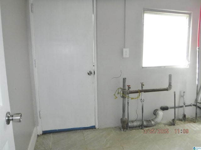 laundry area featuring laundry area and tile patterned flooring