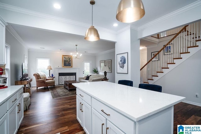 1595 Creekstone Cir, Birmingham, AL 35243 - kitchen featuring hanging light fixtures, dark wood finished floors, white cabinets, recessed lighting, and open floor plan