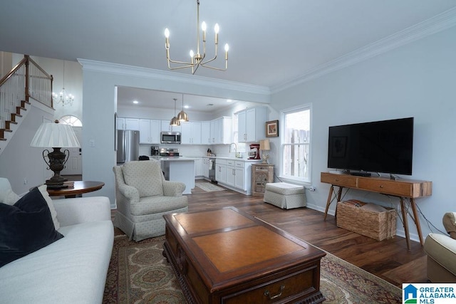1595 Creekstone Cir, Birmingham, AL 35243 - living room featuring a chandelier, crown molding, wood finished floors, and stairs