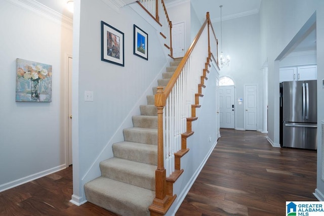 1595 Creekstone Cir, Birmingham, AL 35243 - staircase with a chandelier, wood finished floors, a high ceiling, and ornamental molding