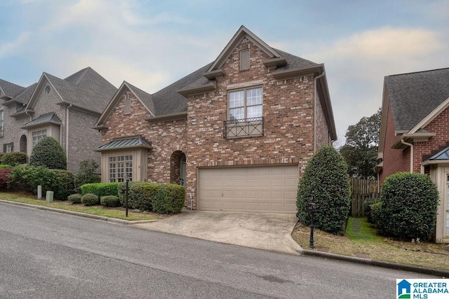 1595 Creekstone Cir, Birmingham, AL 35243 - view of front of home with a garage, concrete driveway, and brick siding