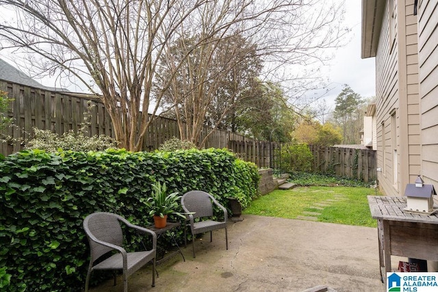 1595 Creekstone Cir, Birmingham, AL 35243 - fenced backyard with a patio area