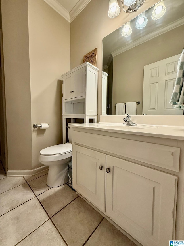 bathroom featuring tile patterned floors, crown molding, toilet, and vanity