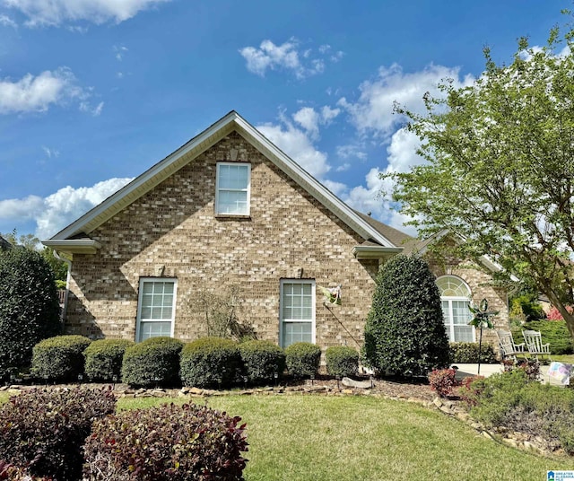 view of front of property featuring brick siding