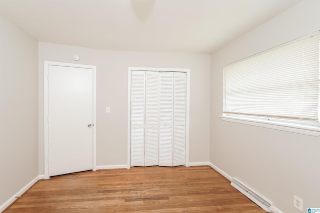 1625 Mann Dr, Birmingham, AL 35214 - unfurnished bedroom with a closet, baseboards, light wood finished floors, and visible vents