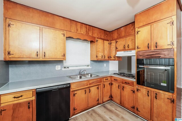 1625 Mann Dr, Birmingham, AL 35214 - kitchen featuring stainless steel stovetop, under cabinet range hood, a sink, black oven, and dishwasher