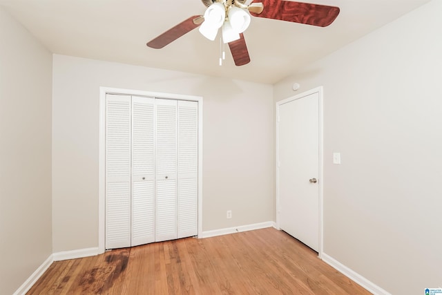 1625 Mann Dr, Birmingham, AL 35214 - unfurnished bedroom featuring a ceiling fan, a closet, baseboards, and light wood-type flooring