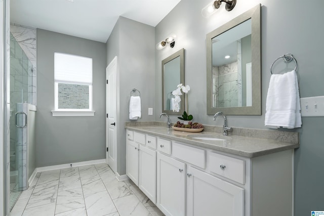 full bath with a sink, tiled shower, and marble finish floor