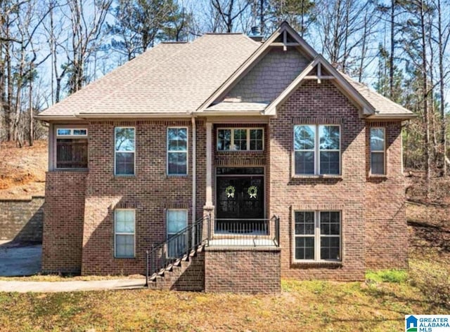 13147 Allison Dr, Lake View, AL 35111 - view of front facade with brick siding, a front yard, and a shingled roof