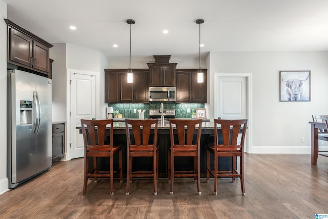 13147 Allison Dr, Lake View, AL 35111 - kitchen featuring tasteful backsplash, dark brown cabinetry, dark wood finished floors, and stainless steel appliances