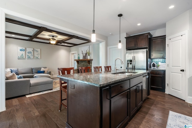 13147 Allison Dr, Lake View, AL 35111 - kitchen with a sink, open floor plan, appliances with stainless steel finishes, a kitchen bar, and dark brown cabinets