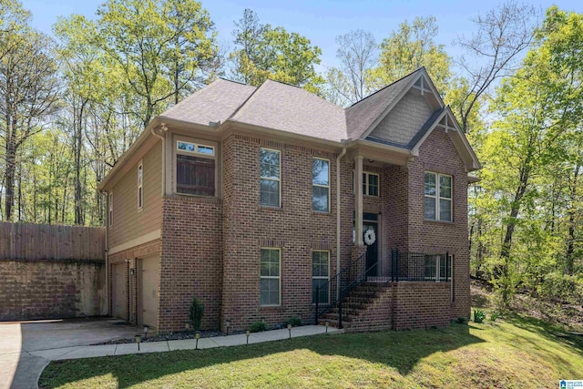 13147 Allison Dr, Lake View, AL 35111 - view of front of home with a garage, fence, concrete driveway, brick siding, and a front lawn