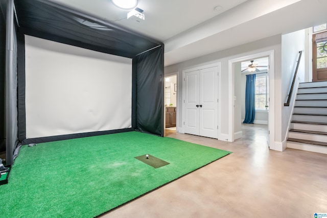 13147 Allison Dr, Lake View, AL 35111 - rec room with golf simulator, finished concrete flooring, baseboards, and a ceiling fan