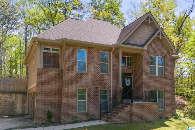 13147 Allison Dr, Lake View, AL 35111 - view of front of house featuring brick siding, fence, and roof with shingles