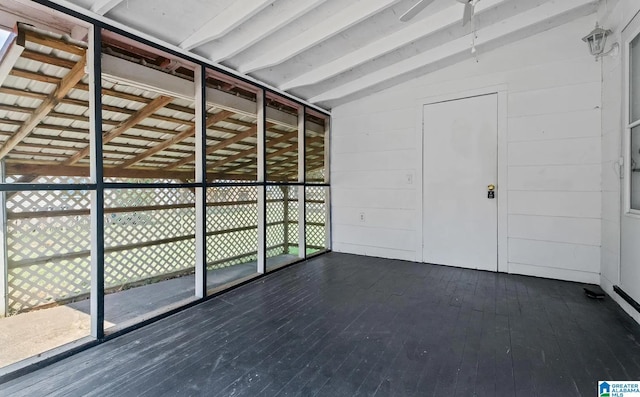 interior space featuring wood-type flooring and vaulted ceiling