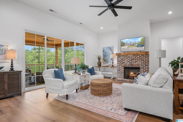 2505 Shore Side Ln, Sylacauga, AL 35151 - living area featuring ceiling fan, a fireplace, visible vents, recessed lighting, and wood finished floors