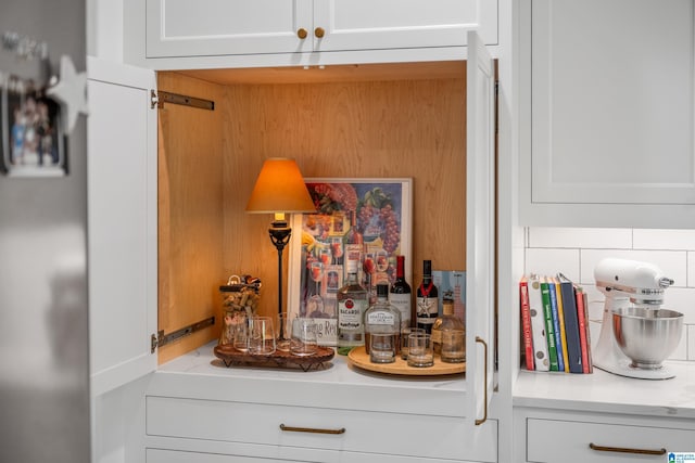 2505 Shore Side Ln, Sylacauga, AL 35151 - interior details with a bar, light countertops, and white cabinetry