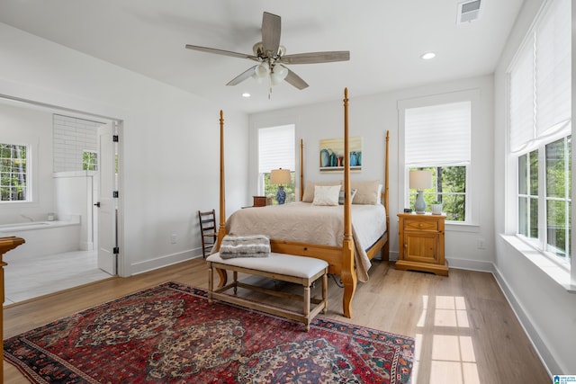 2505 Shore Side Ln, Sylacauga, AL 35151 - bedroom featuring light wood-type flooring, multiple windows, and visible vents