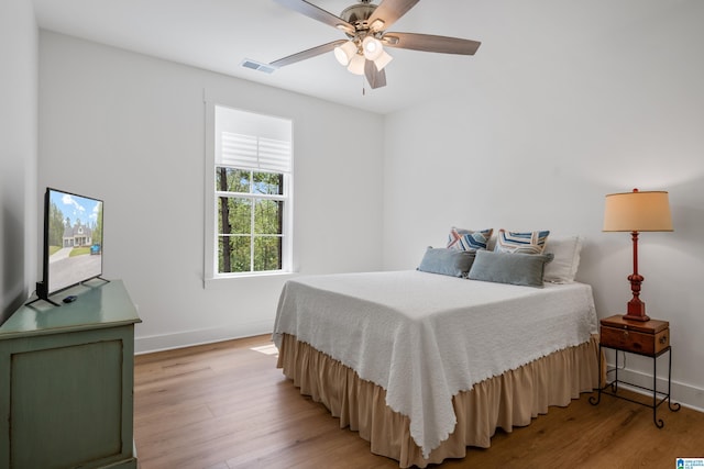 2505 Shore Side Ln, Sylacauga, AL 35151 - bedroom featuring light wood-style floors, baseboards, visible vents, and ceiling fan