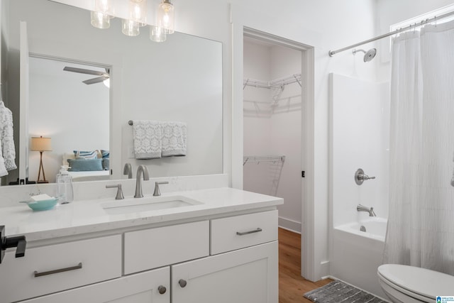 2505 Shore Side Ln, Sylacauga, AL 35151 - full bathroom featuring toilet, wood finished floors, vanity, and shower / tub combo with curtain