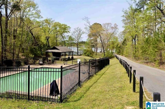 2505 Shore Side Ln, Sylacauga, AL 35151 - view of swimming pool with a yard, a gazebo, and fence