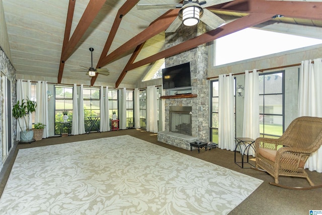 sunroom featuring beamed ceiling