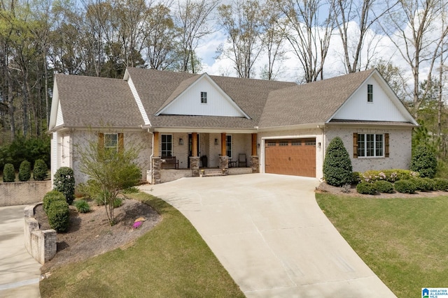 view of front of property with a front yard, a porch, a garage, concrete driveway, and roof with shingles