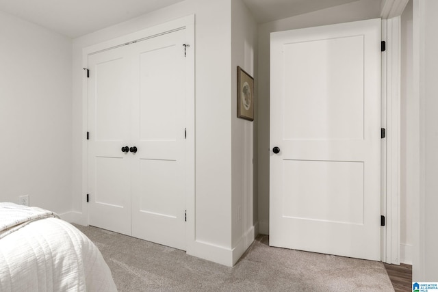 carpeted bedroom with a closet
