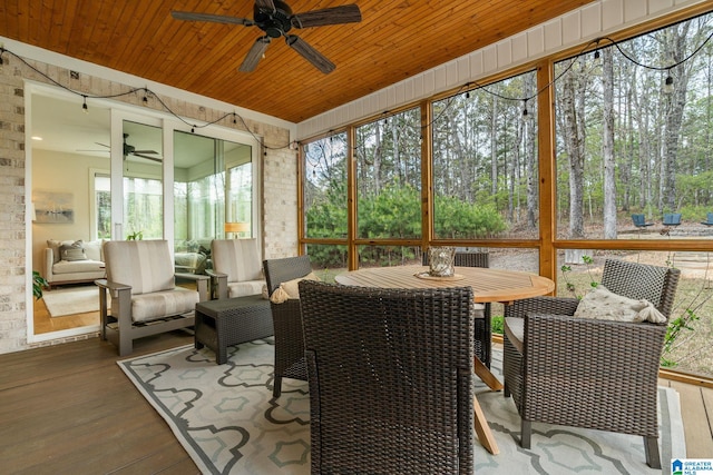sunroom / solarium featuring an outdoor living space, a ceiling fan, and outdoor dining space