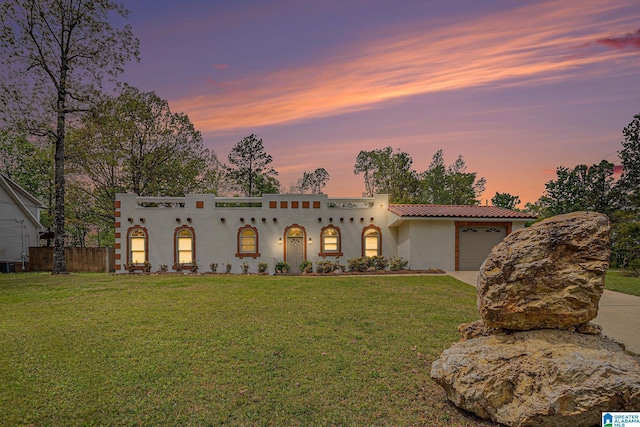 16 Eagle Rock Dr, Alabaster, AL 35007 - mediterranean / spanish-style home featuring a yard, a tiled roof, a garage, stucco siding, and driveway