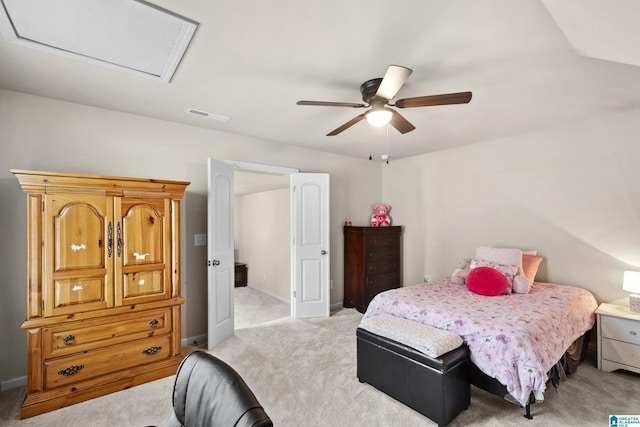 bedroom with visible vents, baseboards, a ceiling fan, and light colored carpet