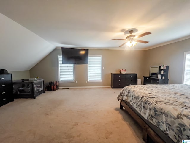 bedroom with ceiling fan, ornamental molding, carpet floors, lofted ceiling, and baseboards