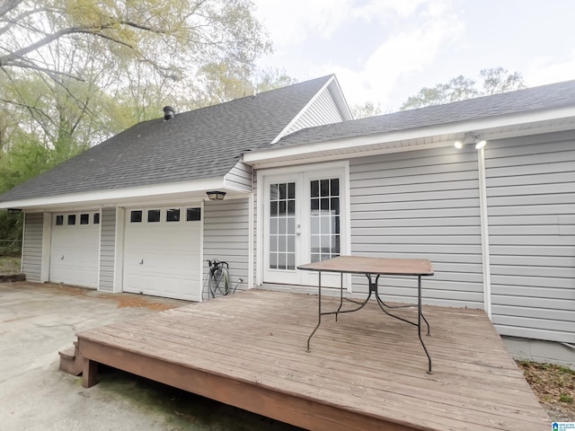 deck featuring french doors and a garage