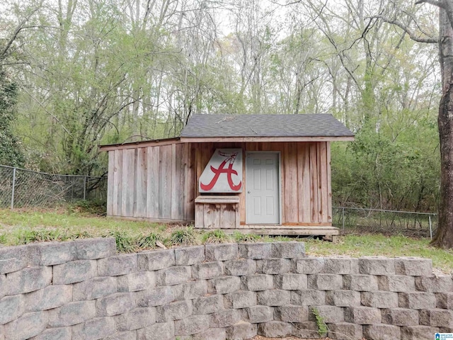 view of shed with fence