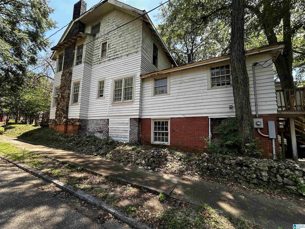 view of home's exterior with a chimney
