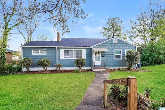 single story home with a front lawn and a chimney