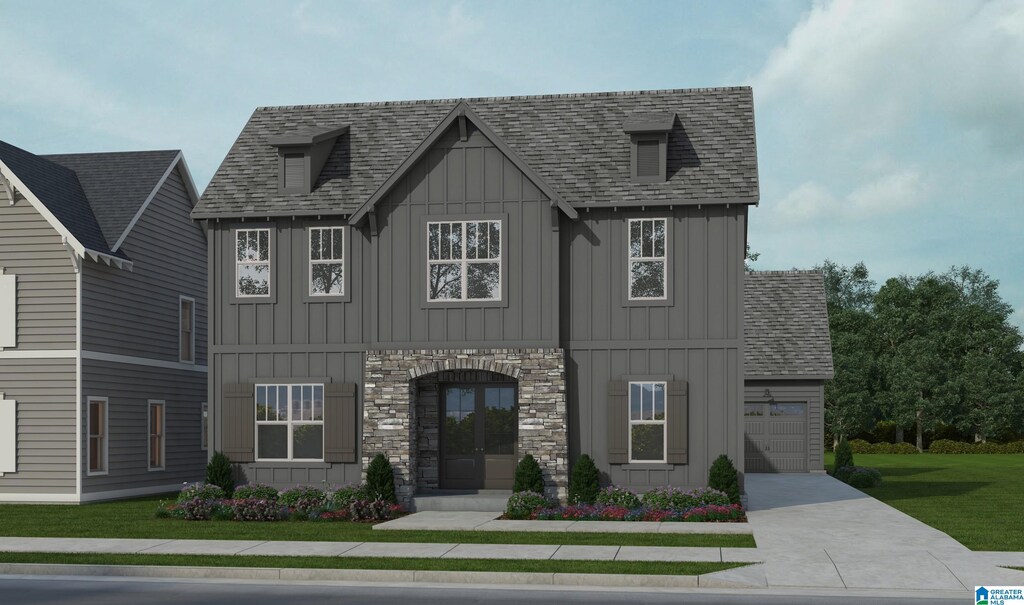 1732 Gable Way, Hoover, AL 35244 - view of front facade featuring concrete driveway, board and batten siding, an attached garage, a front lawn, and a shingled roof
