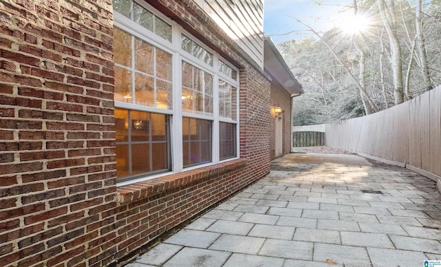 view of patio featuring fence