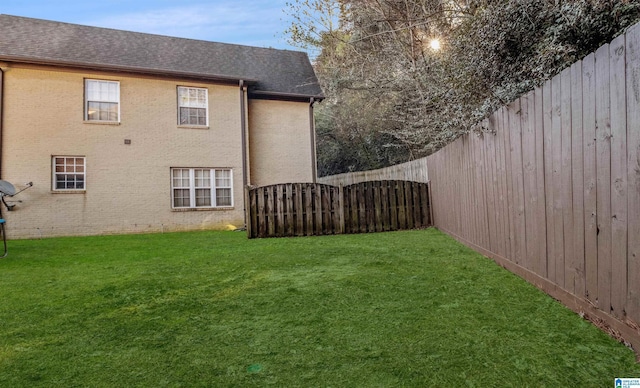 view of yard featuring a fenced backyard