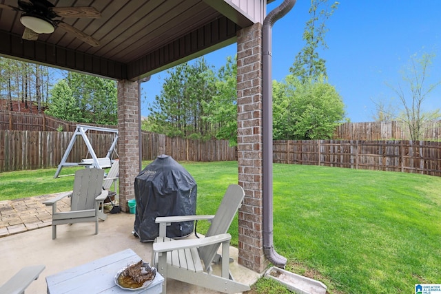 view of patio / terrace featuring grilling area, a fenced backyard, and ceiling fan