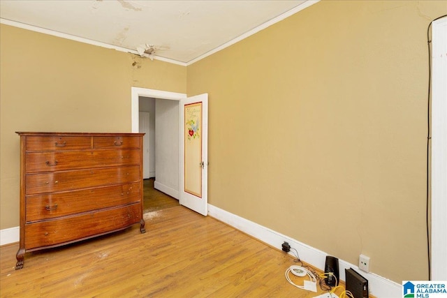 2701 21st St, Birmingham, AL 35208 - bedroom featuring crown molding, baseboards, and light wood-style floors