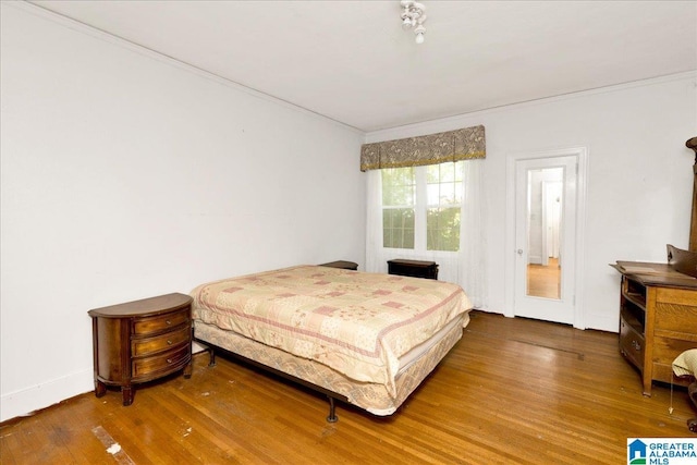 2701 21st St, Birmingham, AL 35208 - bedroom featuring ornamental molding and wood finished floors