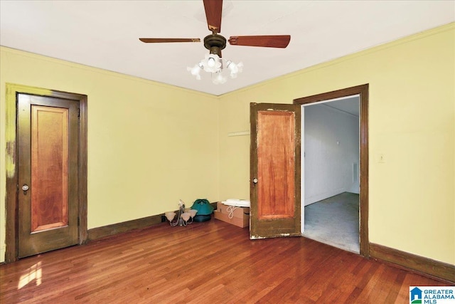 2701 21st St, Birmingham, AL 35208 - spare room featuring ornamental molding, baseboards, ceiling fan, and wood finished floors